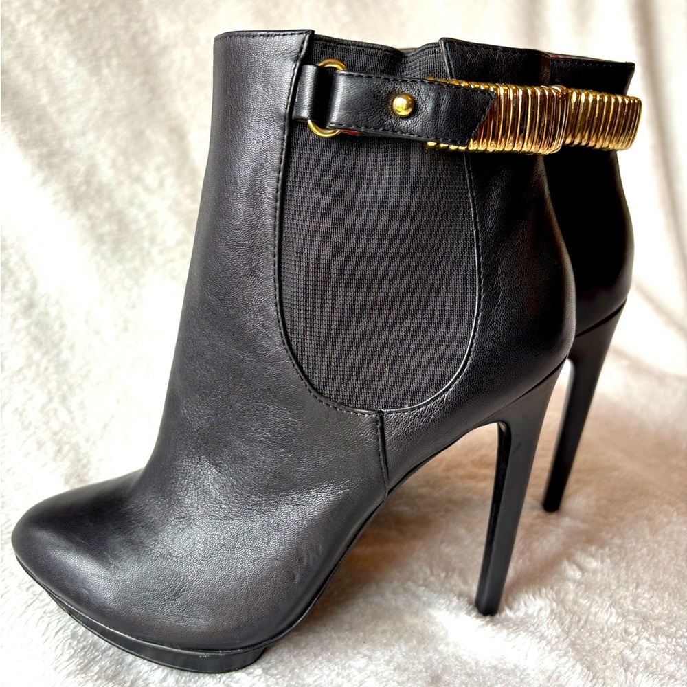 Charles Jordan black ankle boots with gold accent stiletto heels

Never worn